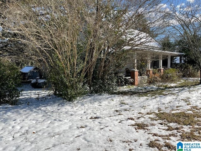 view of yard layered in snow