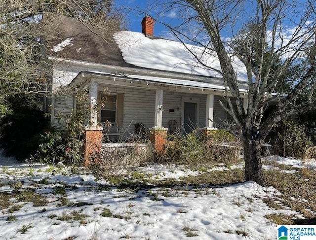 view of front facade featuring a chimney