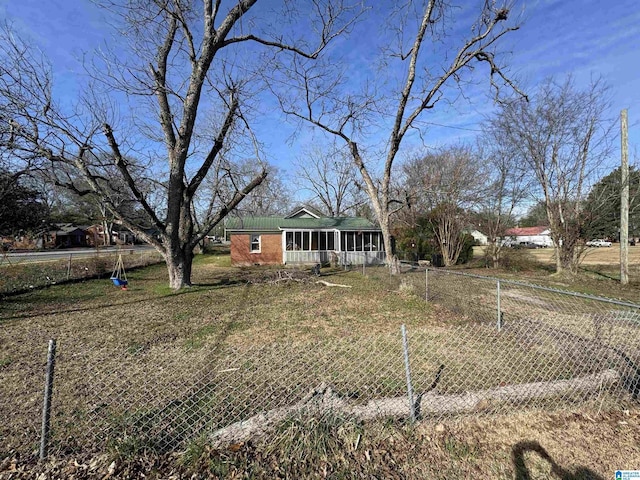 view of front of property featuring fence and brick siding