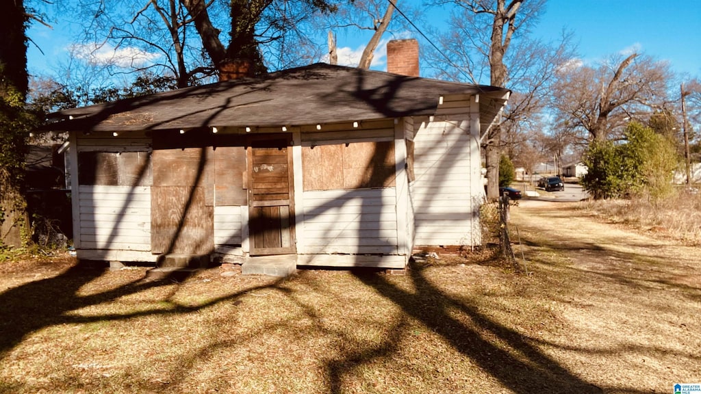 back of property featuring a chimney