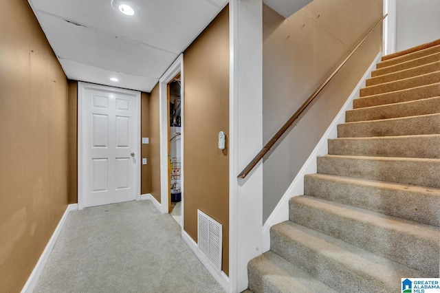 interior space featuring carpet floors, baseboards, visible vents, and recessed lighting