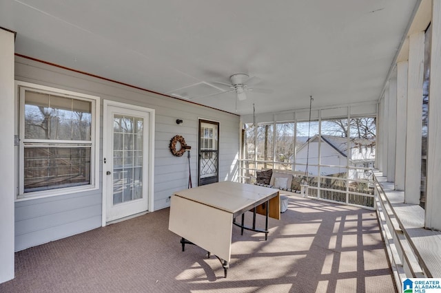 sunroom with ceiling fan