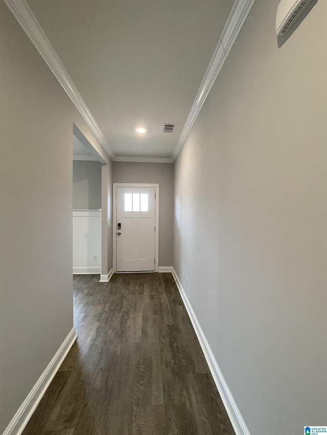 entryway with visible vents, a wall mounted AC, crown molding, baseboards, and dark wood-style flooring