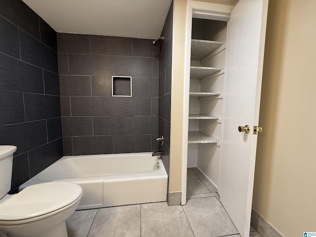 bathroom with toilet, shower / tub combination, and tile patterned flooring