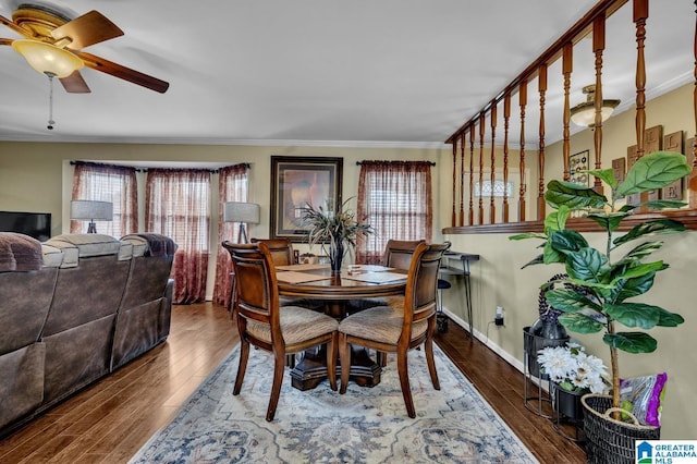 dining space with ornamental molding, wood finished floors, and a ceiling fan