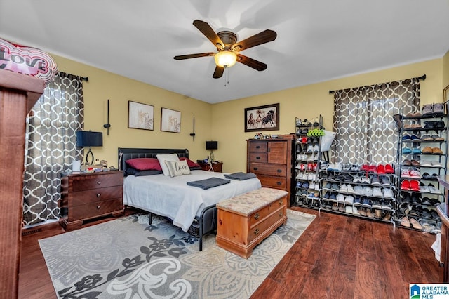 bedroom with a ceiling fan and wood finished floors