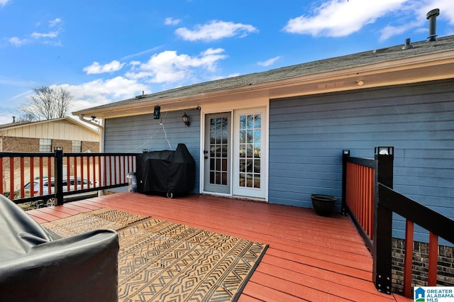 wooden terrace with a grill