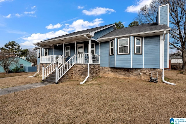 single story home with a chimney, a porch, and a front yard