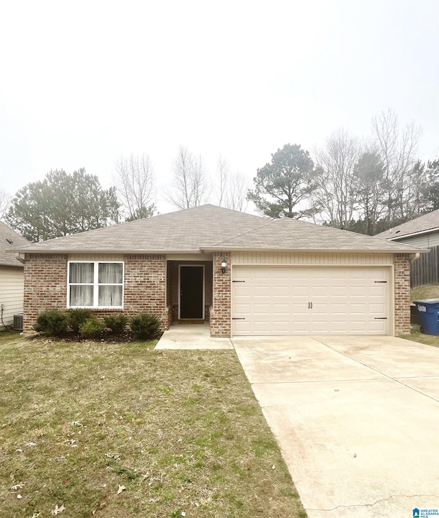 single story home featuring an attached garage, central air condition unit, brick siding, driveway, and a front lawn