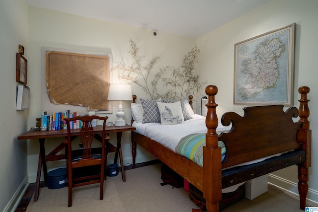 carpeted bedroom featuring baseboards