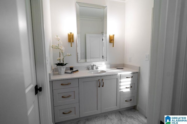 bathroom featuring marble finish floor and vanity