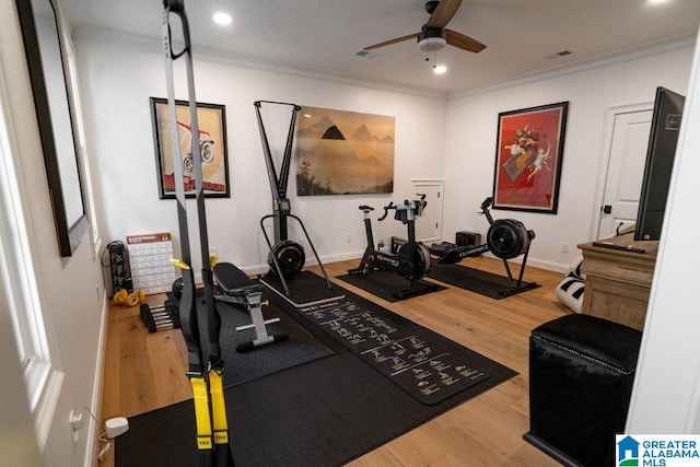 workout area with recessed lighting, visible vents, ornamental molding, a ceiling fan, and light wood-type flooring