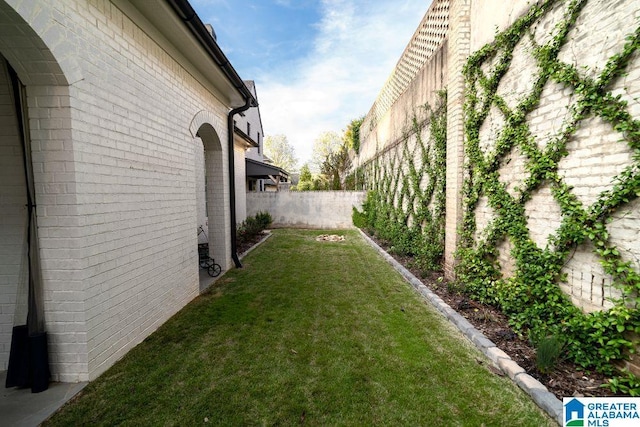 view of yard with a fenced backyard