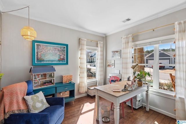 office space with a wealth of natural light, visible vents, and dark wood finished floors