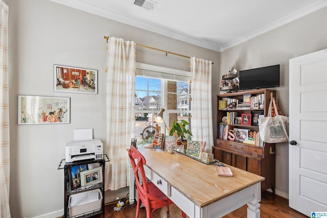 office with baseboards, visible vents, dark wood-type flooring, and ornamental molding