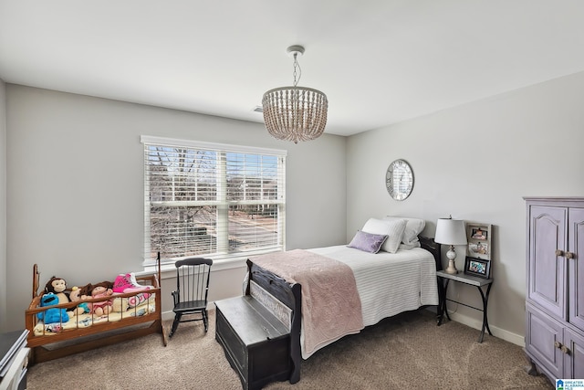 bedroom with baseboards, carpet flooring, and an inviting chandelier