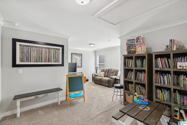 sitting room with attic access, crown molding, carpet floors, and baseboards