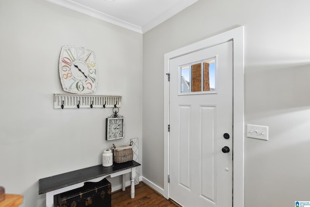 foyer featuring baseboards, dark wood finished floors, and crown molding