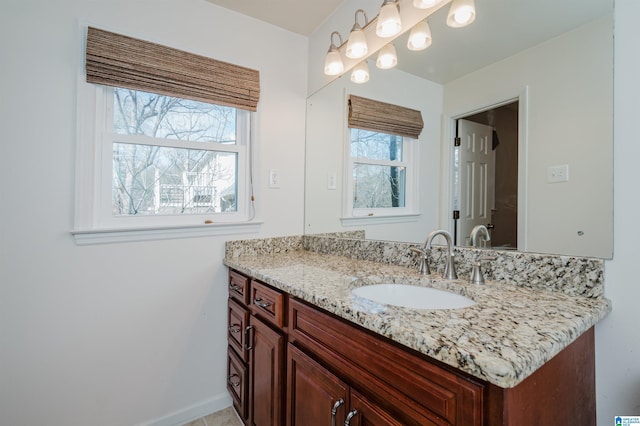 bathroom featuring vanity and baseboards