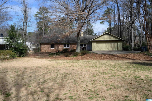 ranch-style home featuring a front yard and brick siding