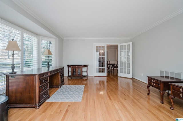 sitting room with ornamental molding, french doors, light wood-type flooring, and visible vents