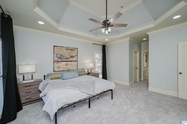 bedroom with light carpet, crown molding, a raised ceiling, and baseboards