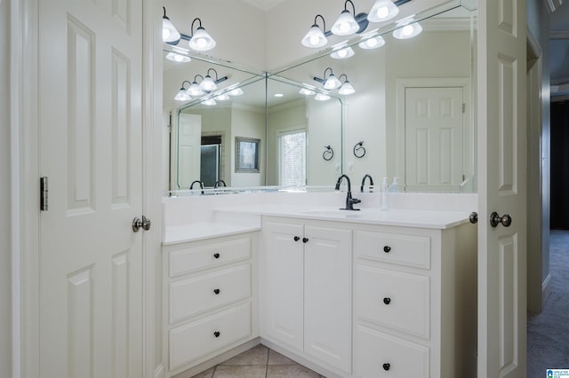 bathroom featuring tile patterned flooring and vanity