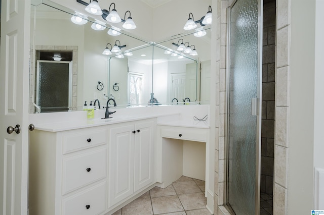 full bath featuring tile patterned flooring, vanity, and a shower stall