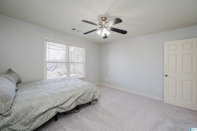 bedroom with carpet floors, baseboards, visible vents, and ceiling fan