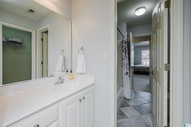 bathroom featuring visible vents, shower / bath combo, vanity, and tile patterned floors