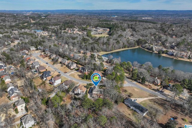 birds eye view of property featuring a water view and a residential view