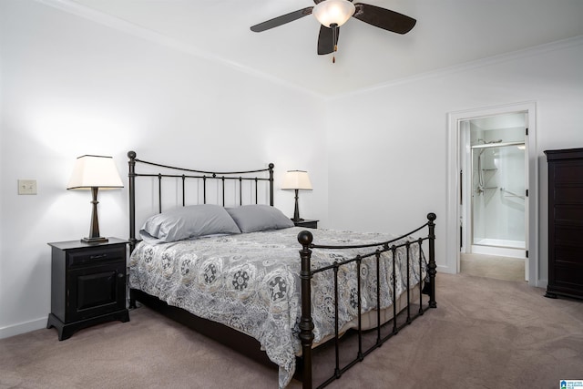 carpeted bedroom with ceiling fan, ornamental molding, ensuite bath, and baseboards