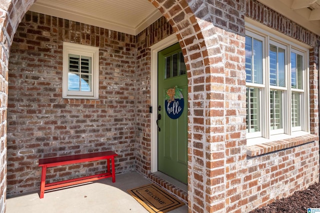 entrance to property with brick siding