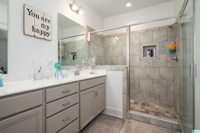 full bath with a stall shower and vanity