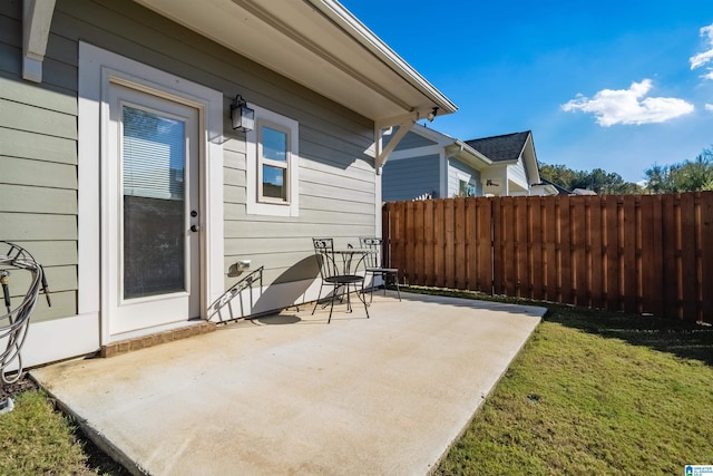 view of patio / terrace featuring fence