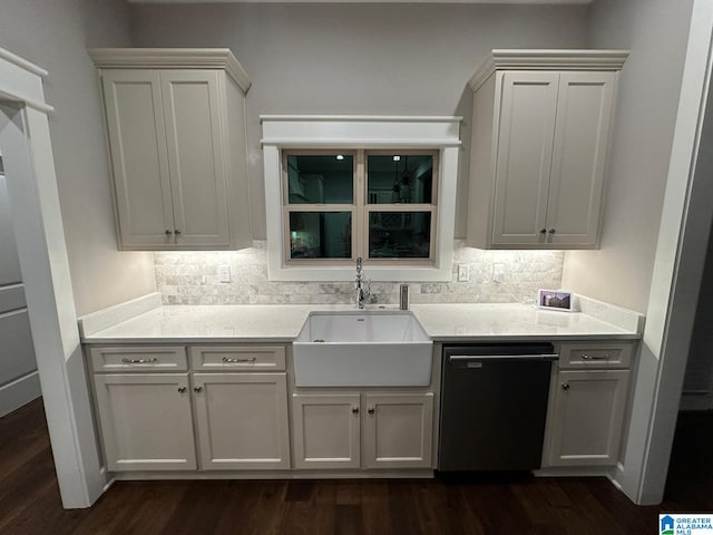 kitchen with dishwasher, decorative backsplash, a sink, and dark wood-style floors