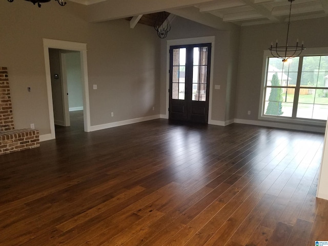 interior space with dark wood-type flooring, a notable chandelier, and beamed ceiling