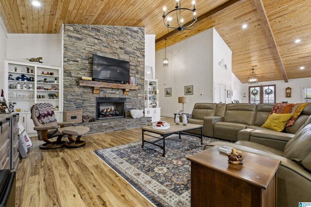 living room with wooden ceiling, wood finished floors, a fireplace, high vaulted ceiling, and beam ceiling
