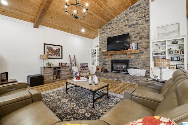 living area with an inviting chandelier, a stone fireplace, wood finished floors, high vaulted ceiling, and wooden ceiling