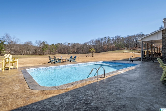 pool featuring a patio area