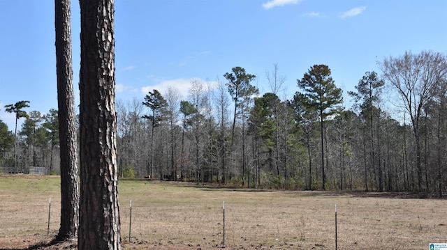 view of landscape with a forest view