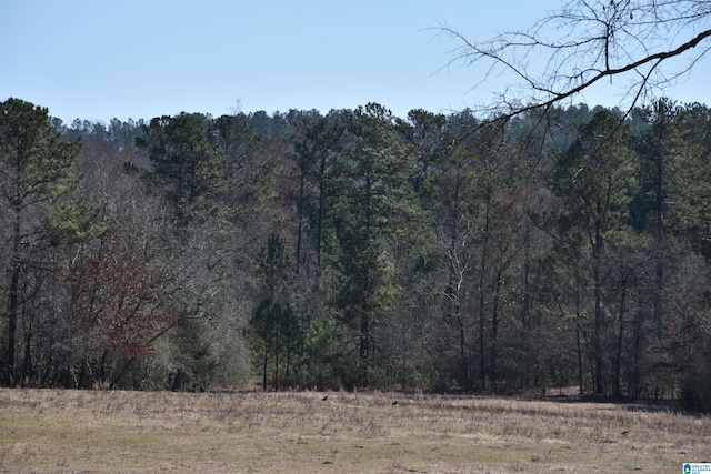 view of landscape with a forest view