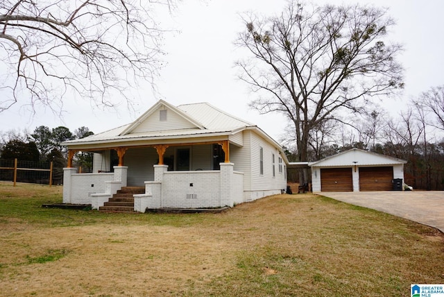 view of front of property with a garage, a porch, crawl space, an outdoor structure, and a front lawn