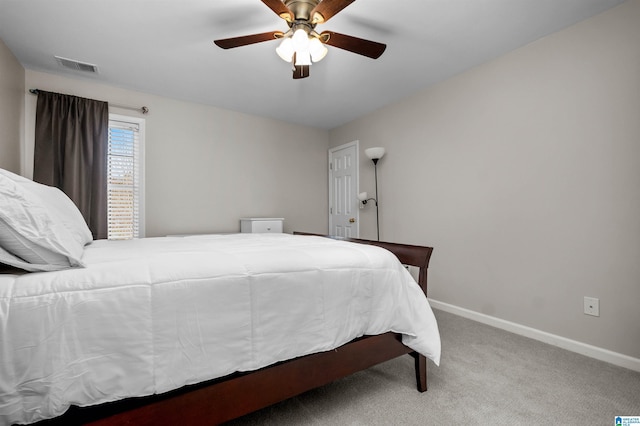 bedroom featuring a ceiling fan, baseboards, visible vents, and carpet flooring