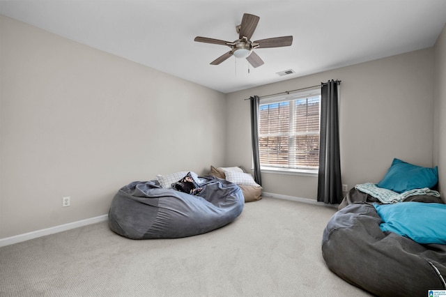 carpeted bedroom with baseboards, visible vents, and ceiling fan