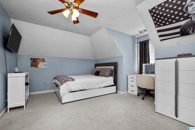 bedroom featuring carpet floors, visible vents, a ceiling fan, vaulted ceiling, and baseboards