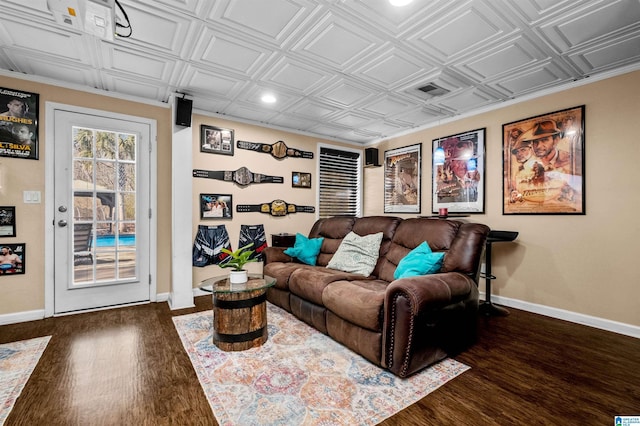 living room featuring an ornate ceiling, baseboards, and dark wood-style flooring