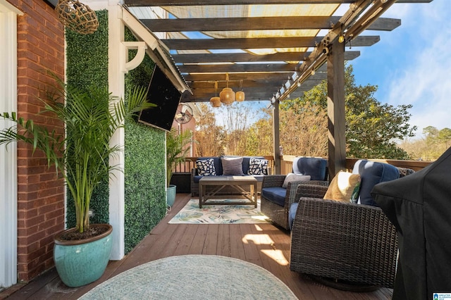 wooden terrace with outdoor lounge area and a pergola