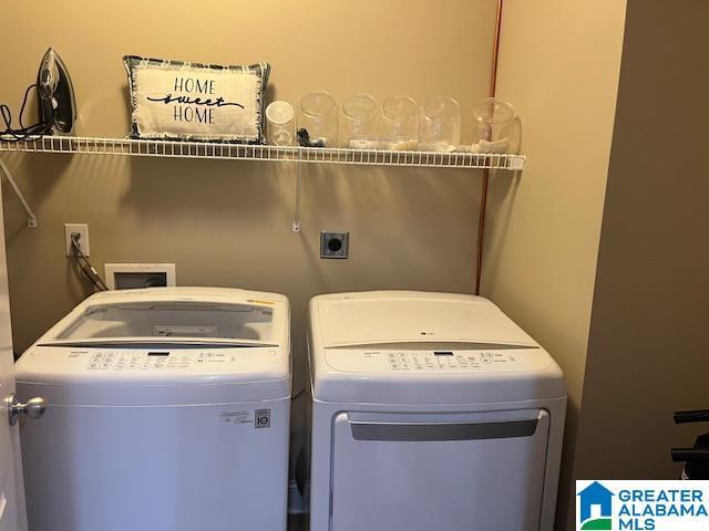 washroom featuring laundry area and washer and dryer