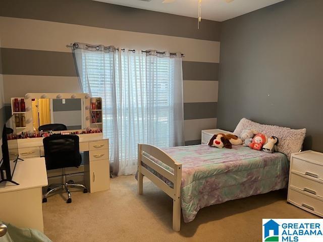 bedroom with light colored carpet